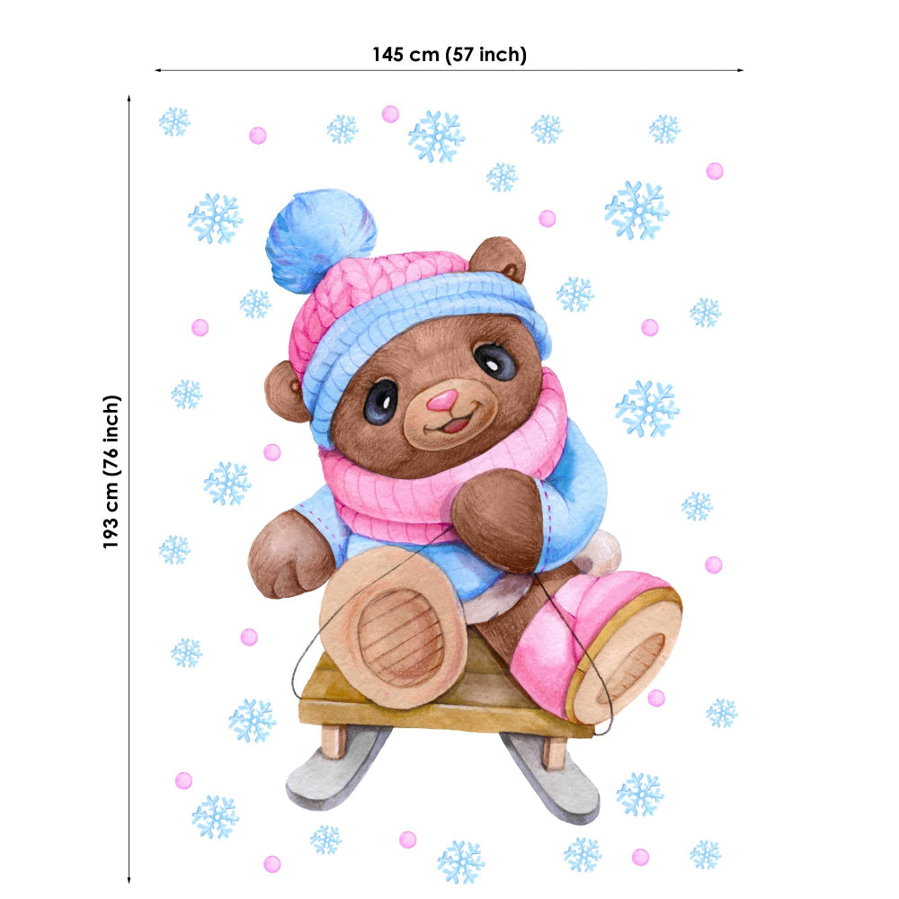 Fabric panel of a teddy bear on skates with winter accessories and snowflake decorations.