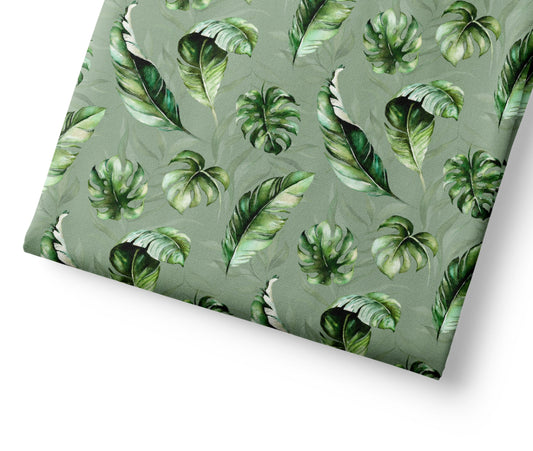 Tropical leaf pattern on a green background