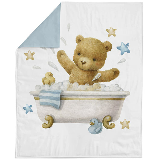A fabric panel featuring a cute baby teddy bear in a bath tub with stars and a blue handle, on a white background.