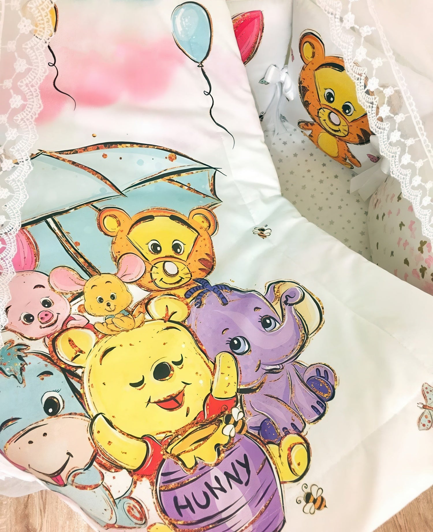 Cotton fabric with a print of Winnie The Pooh and his friend under blue umbrella 