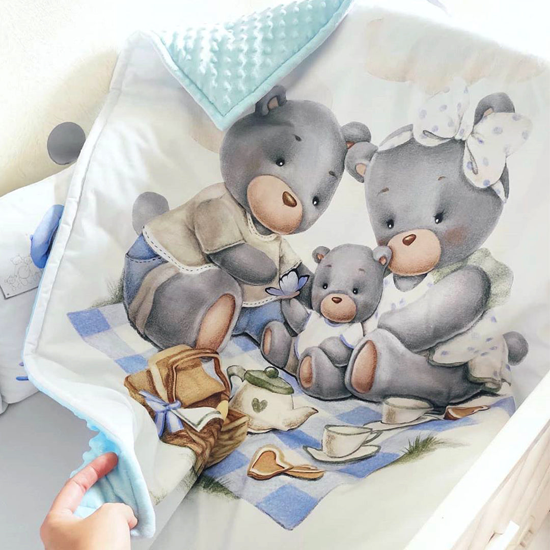 Cotton fabric with a print of family of blue teddy bears
