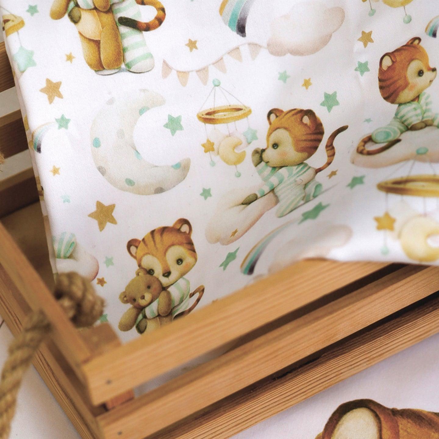 Cotton fabric with a print of cute lions in mint pijamas, space theme