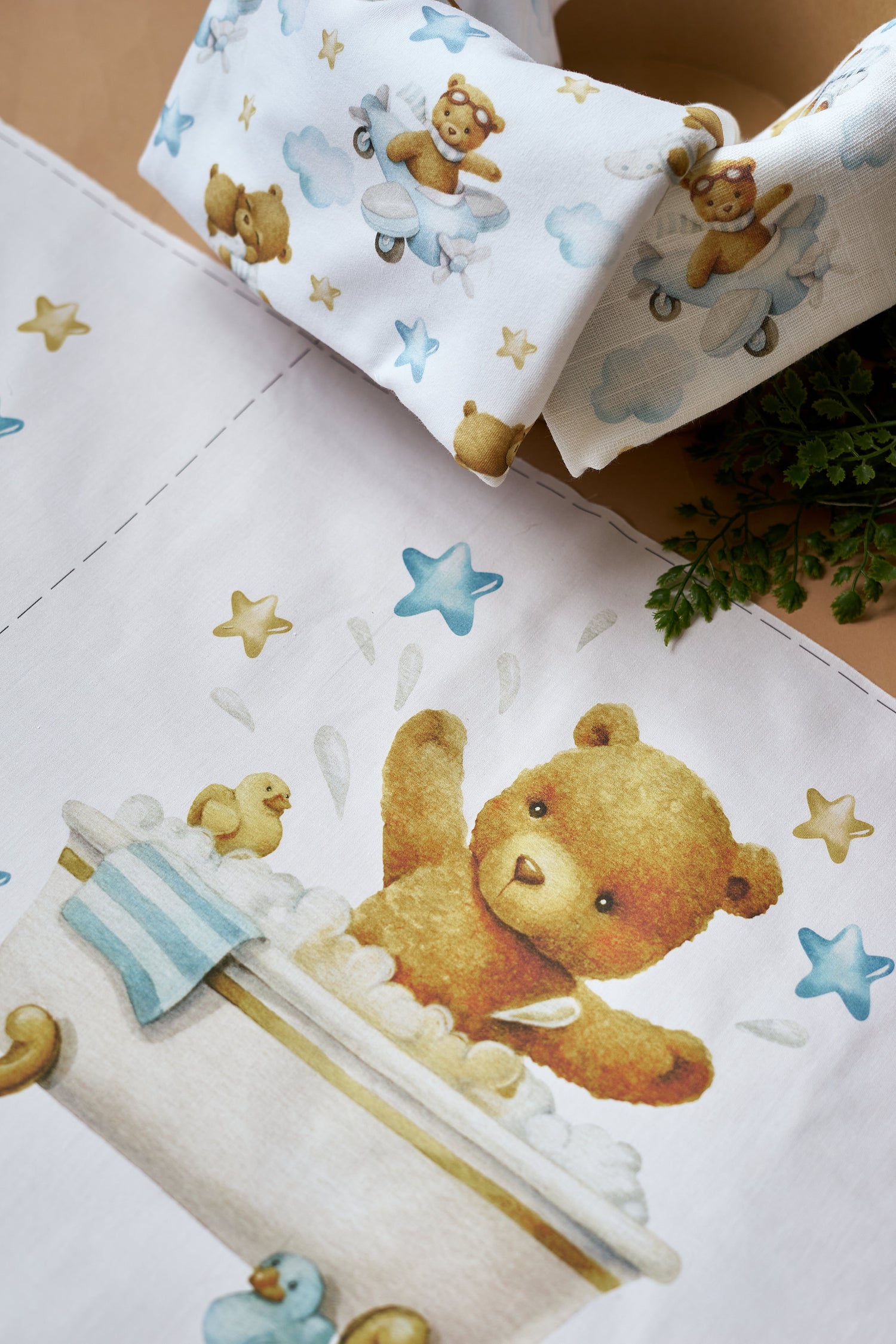 Cotton fabric with a print of brown teddy bear in the bath