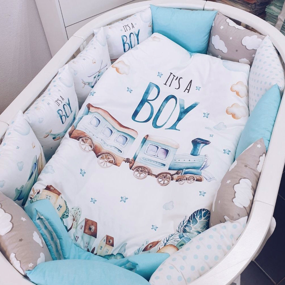 Cotton fabric with a print of blue train with the text "It's a Boy"