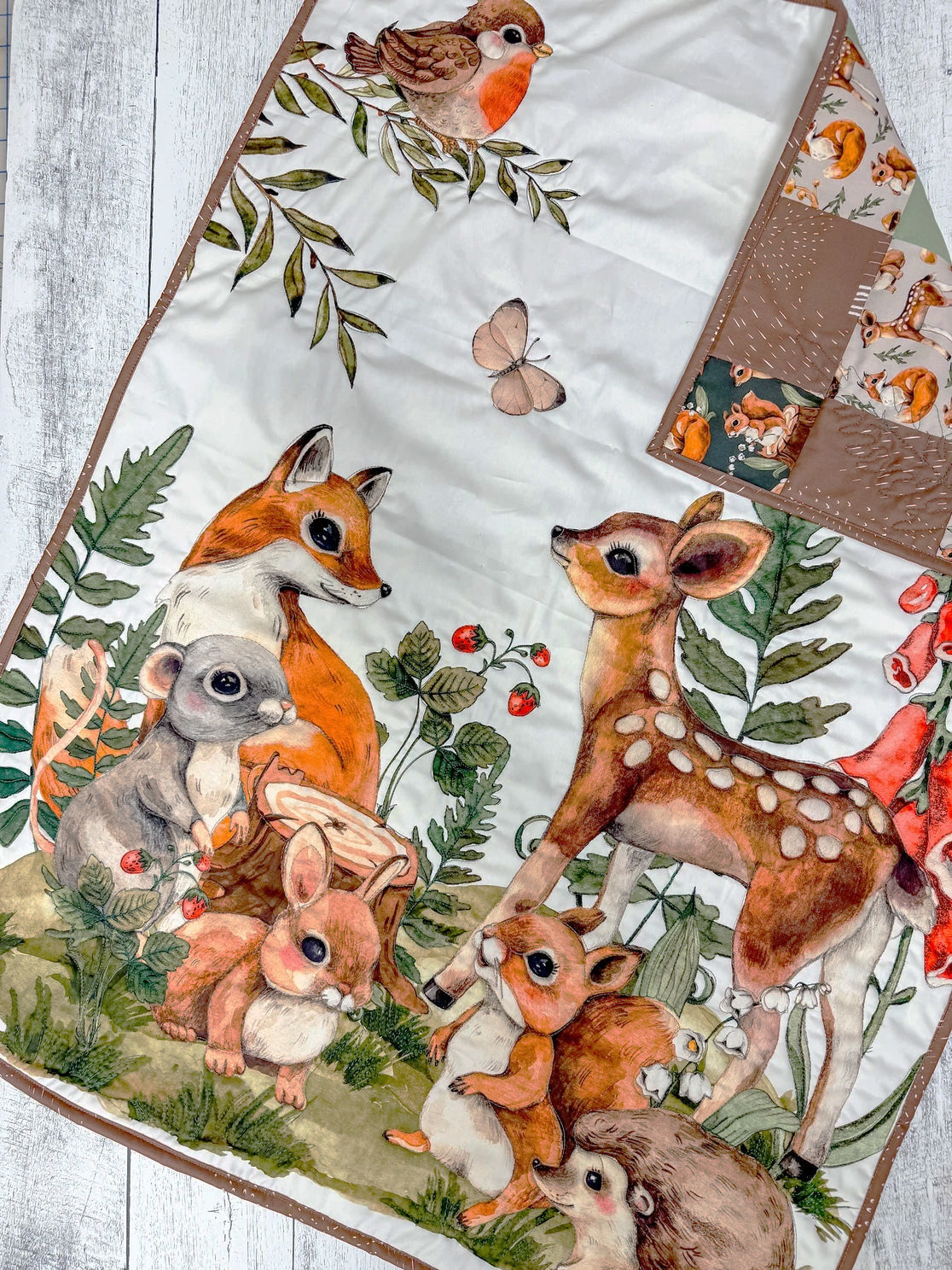 Cotton fabric with a print of a lot woodland animals, such as fox, mouse, deer, rabbit, hedgehog and squirrel