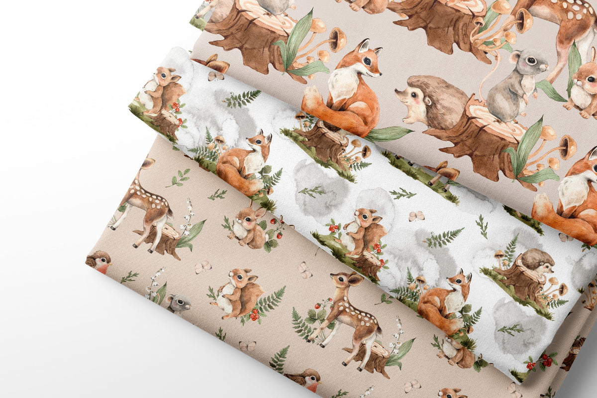 Woodland animal-themed coordinating fabric with deer, fox, and rabbit designs on a white background.
