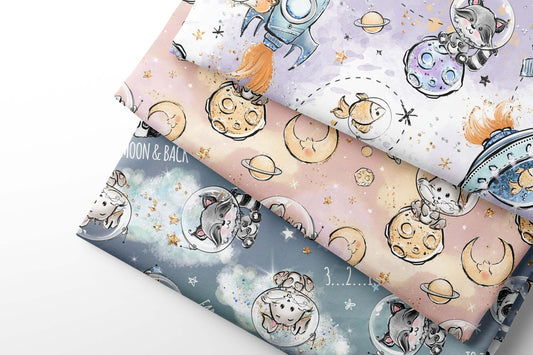 Three rolls of coordinating fabric with space-themed designs featuring astronauts, planets, and stars.