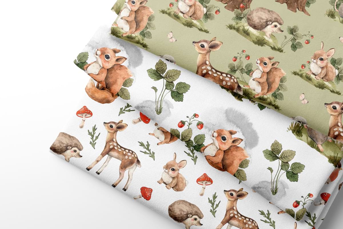Fabric sheets with deer and nature pattern on a light background