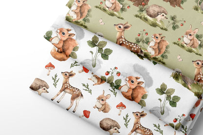 Fabric sheets with deer and nature pattern on a light background
