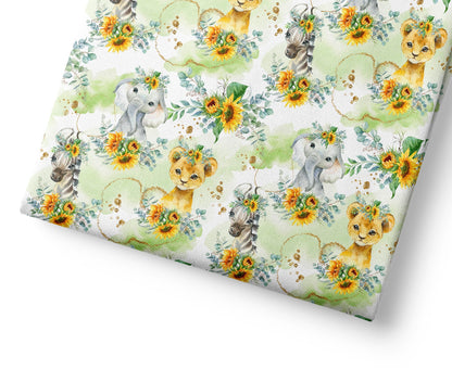 Patterned paper with safari animals and sunflowers on a white background