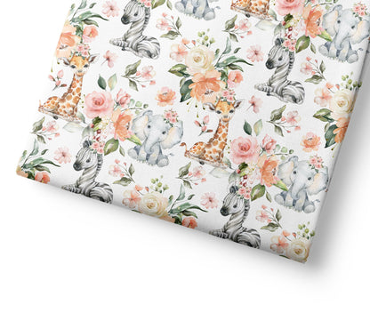 Floral patterned fabric with animal illustrations on a white background