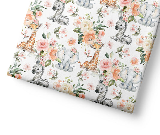 Floral patterned fabric with animal illustrations on a white background