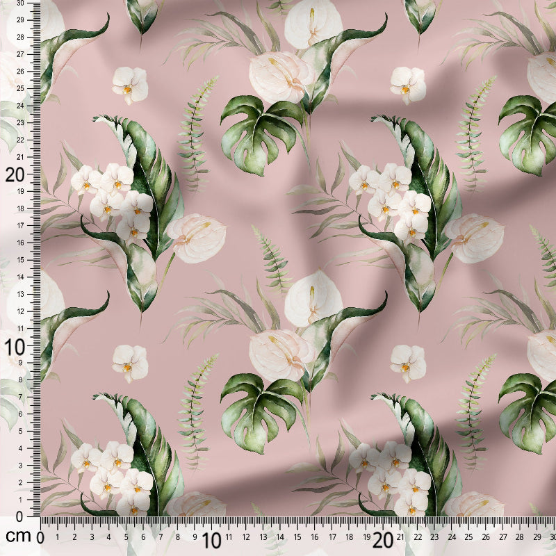 Fabric with white flowers and green leaves on a pink background, featuring a ruler for scale.