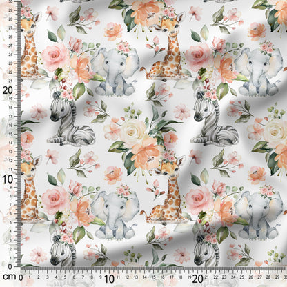 Fabric with baby animals and flowers pattern on a white background with a ruler for scale.