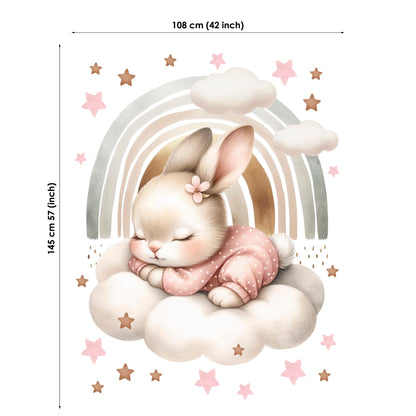 Wall decal of a bunny sitting on a cloud with a rainbow and stars, showing dimensions.