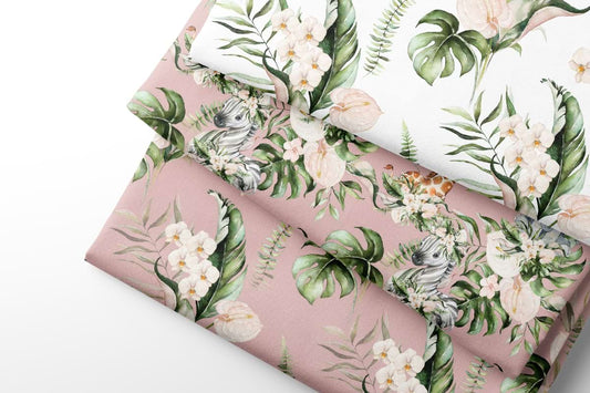 Pink fabric with tropical leaf and flower pattern on a white background