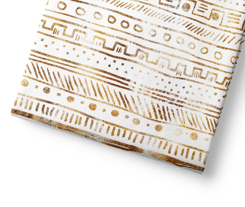 Folded fabric with gold geometric pattern on a white background