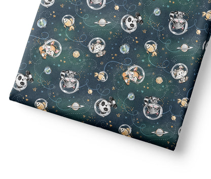 Coordinating fabric with space-themed design featuring planets, stars, and cartoon characters on a dark blue background.