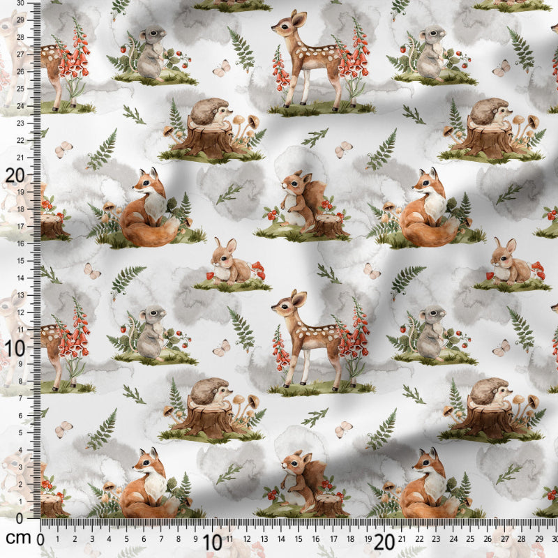 Coordinating fabric with forest animals pattern including deer, foxes, and squirrels on a white background.