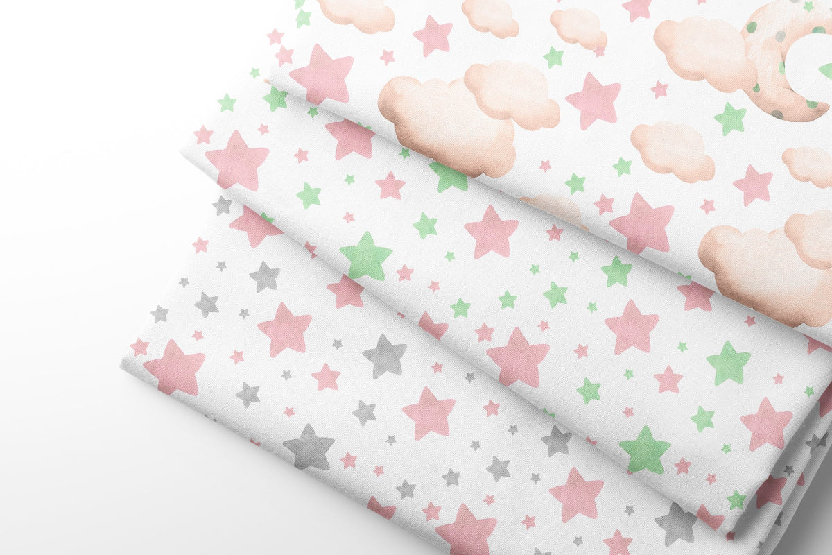 Three rolls of fabric with stars and clouds patterns on a white background