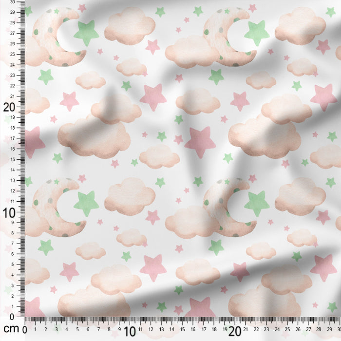 Fabric with cloud and star pattern on a white background, measured with a ruler.