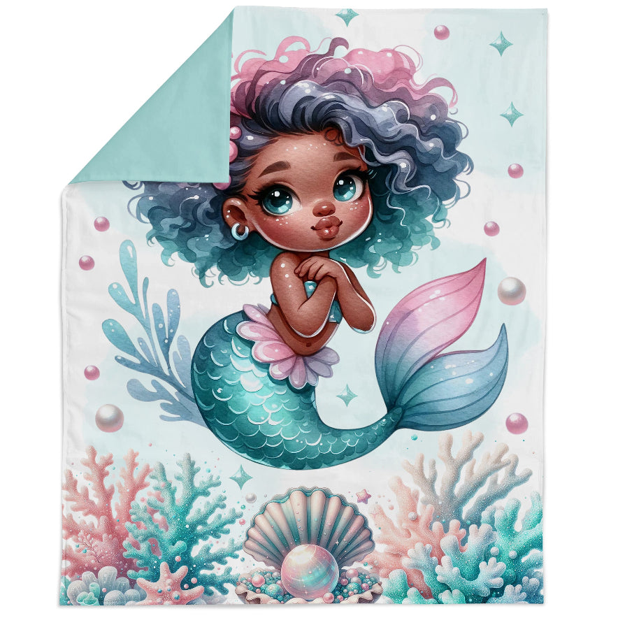 Fabric panel of a balck mermaid with a colorful tail and hair on a white background.