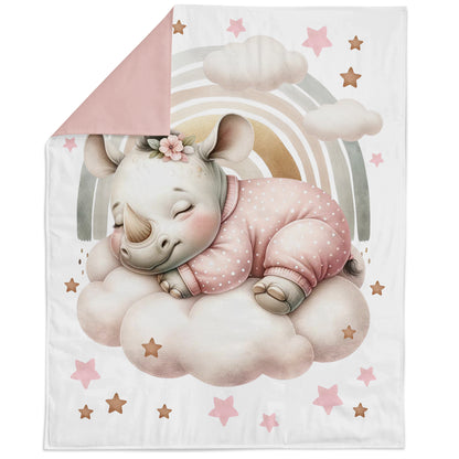 Blanket with a rhino design on a cloud and rainbow, surrounded by stars.