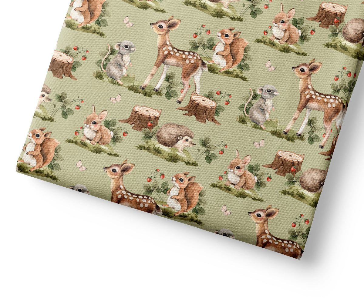 Woodland coordinating fabric with a pattern of deer and nature elements on a green background