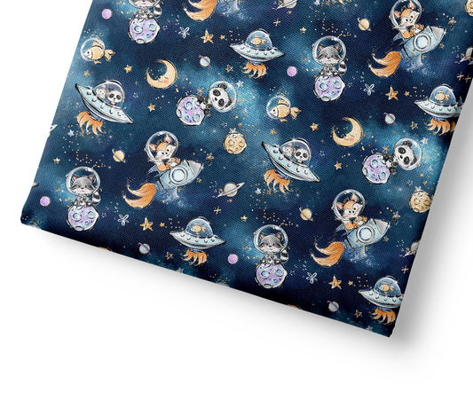 Patterned fabric with space-themed design featuring astronauts, planets, and rockets on a blue background.