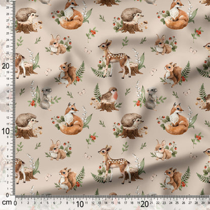 Fabric with forest animal pattern including deer, foxes, and rabbits on a beige background.
