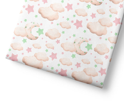 Patterned coordinating fabric with clouds and stars on a white background