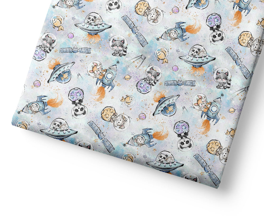 Coordinating fabric with space-themed design featuring astronauts, alien spaceships, and planets.