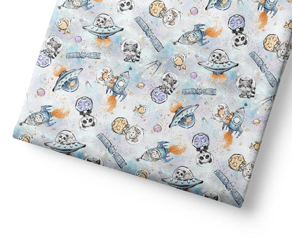Coordinating fabric with space-themed design featuring astronauts, alien spaceships, and planets.