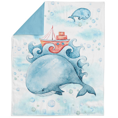 A fabric panel featuring a whale with a stylized design, intended for quilting and sewing projects.