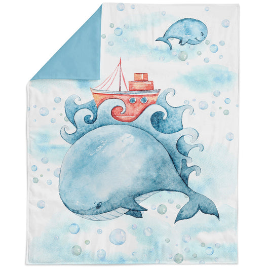 A fabric panel featuring a whale with a stylized design, intended for quilting and sewing projects.
