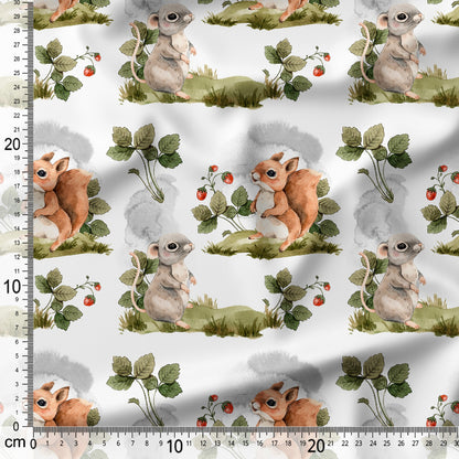 Fabric with animal pattern featuring small creatures and plants on a white background, with a ruler for scale.