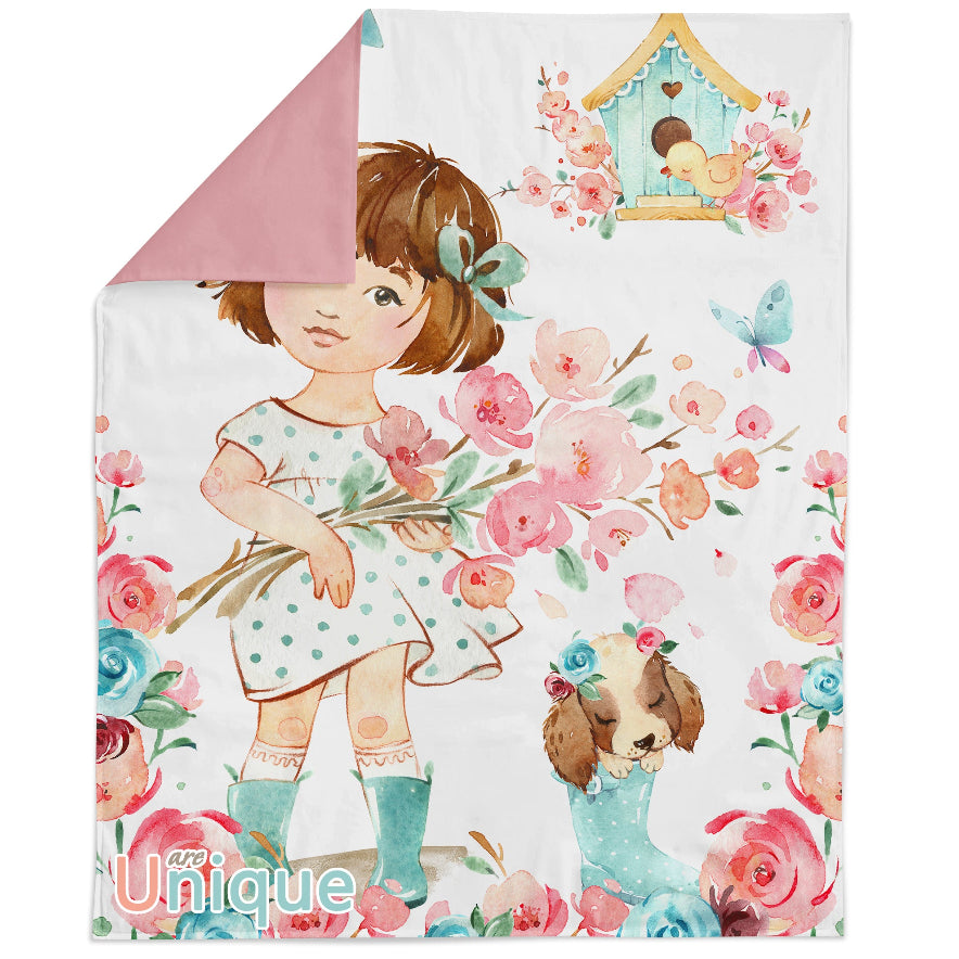 A fabric panel featuring a character holding flowers, surrounded by a floral pattern, with a pink border at the top.