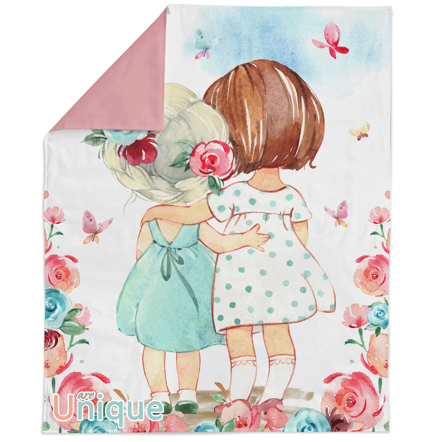 A fabric panel featuring an illustration of two cartoon girls with flowers, indicating a theme of 'little girls' and suitable for quilting or crafting projects.