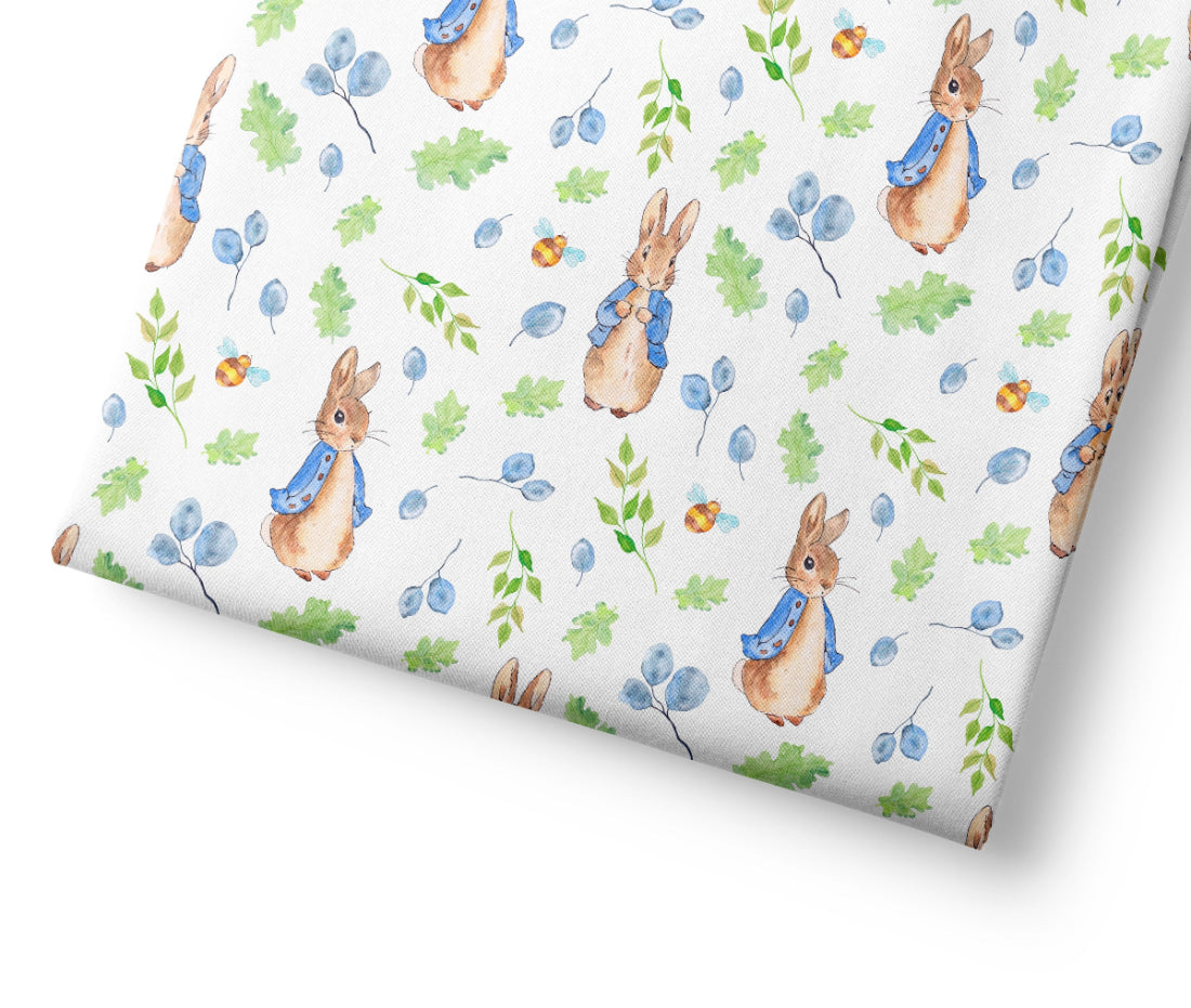 Coordinating fabric with Peter Rabbit pattern on a white background