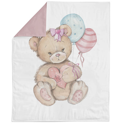 A fabric panel featuring a cartoon bear with a pink bow holding a balloon, with a pink and blue background.
