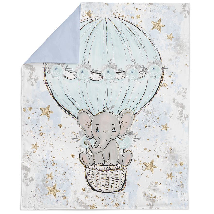 Fabric panel with a printed design featuring a baby elephant, stars, and a hot air balloon, predominantly in blue and white tones.