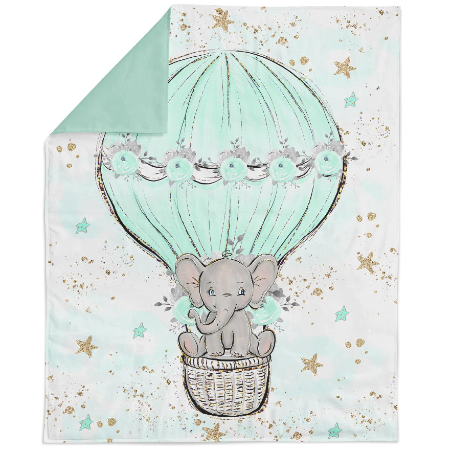 Fabric panel with a printed design featuring a baby elephant, stars, and floral patterns on a green background.