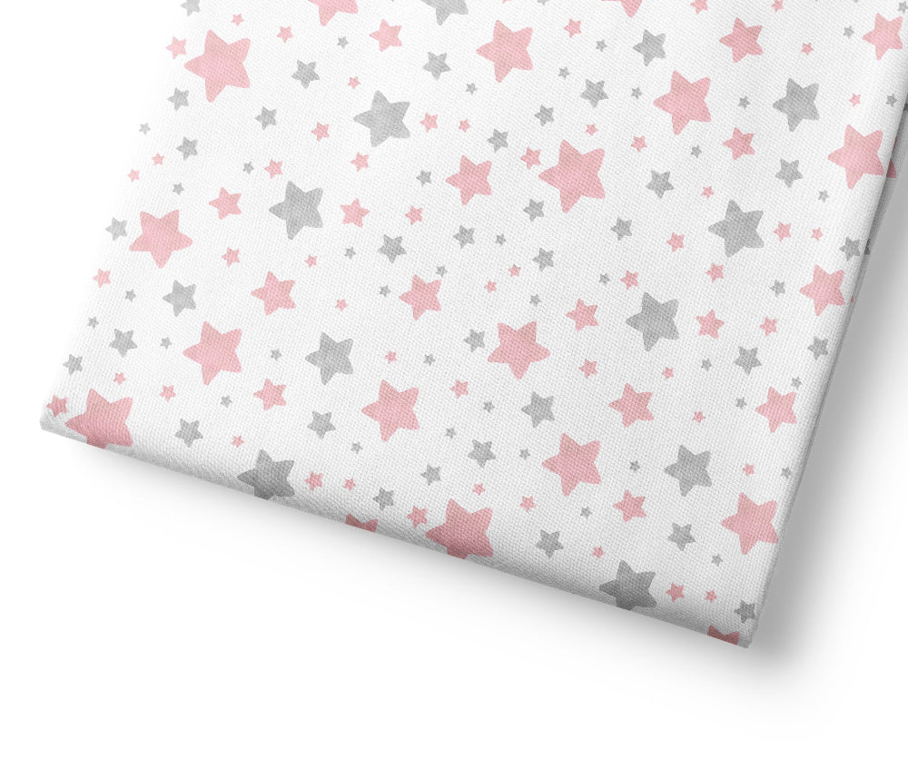Coordinating patterned fabric with pink and gray star pattern on a white background