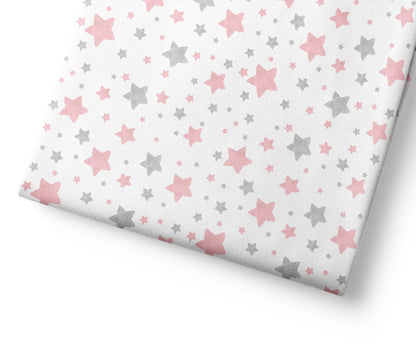 Coordinating patterned fabric with pink and gray star pattern on a white background