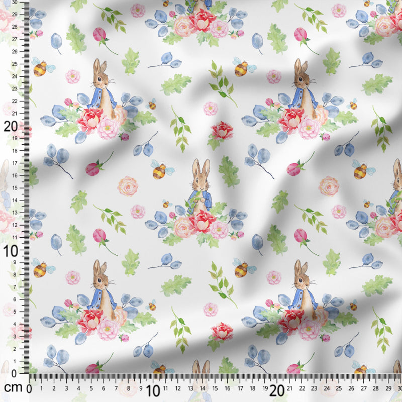 Floral fabric with cartoon characters and a ruler for scale