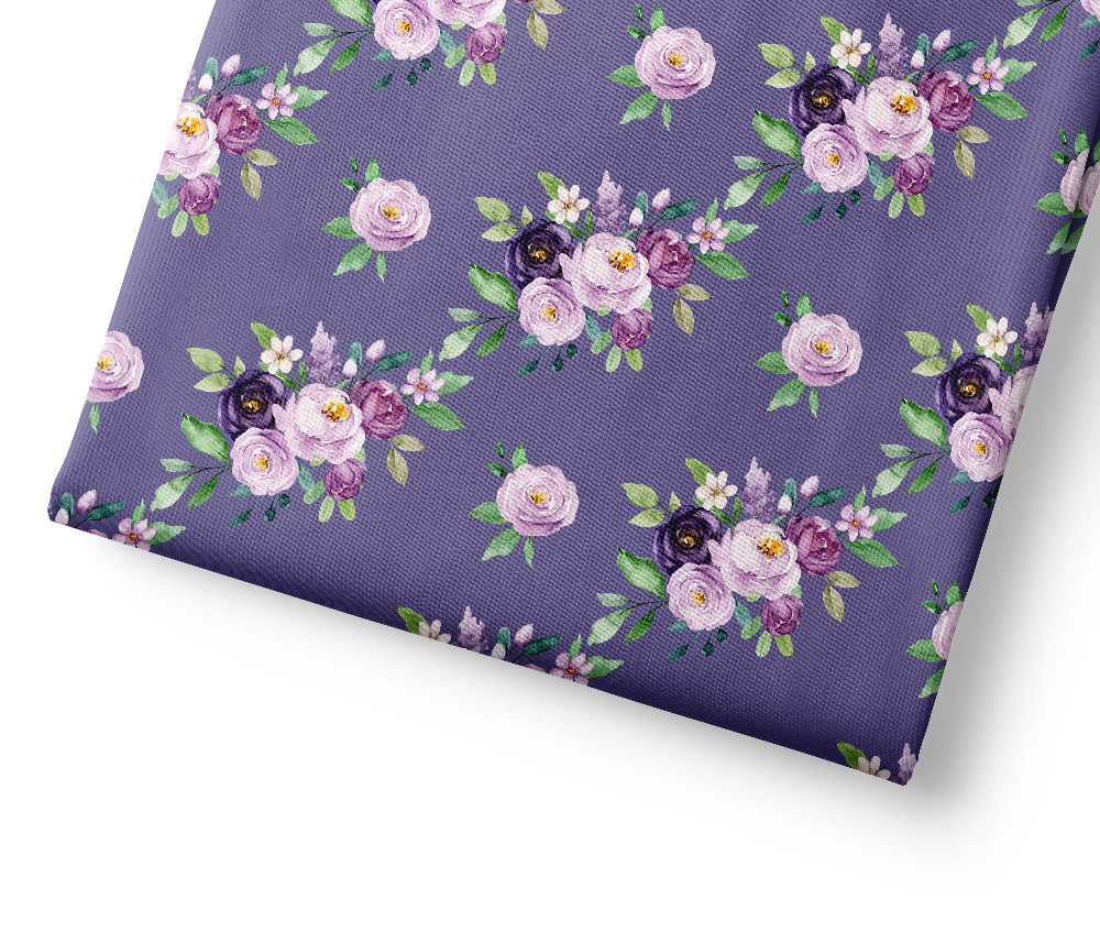 Floral patterned fabric with purple flowers on a purple background