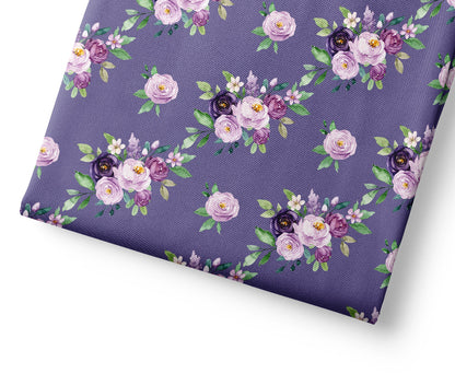 Floral patterned fabric with purple flowers on a purple background