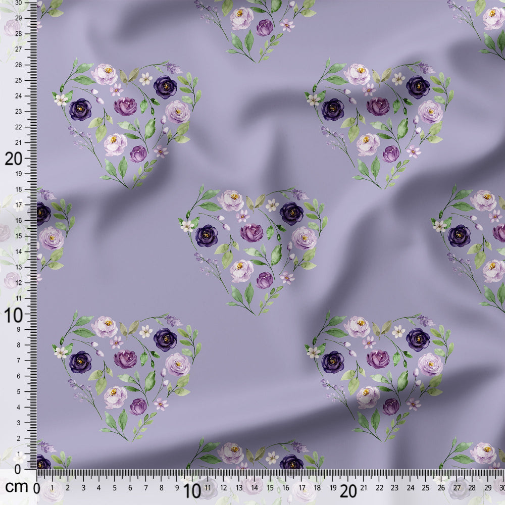 Floral heart patterns on a purple fabric with a ruler for scale.