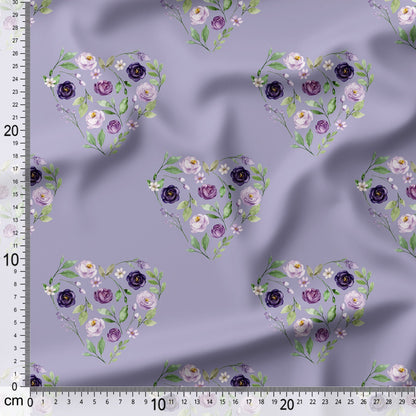 Floral heart patterns on a purple fabric with a ruler for scale.