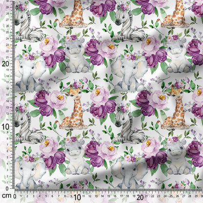 Patterned fabric with baby animals and flowers on a white background, featuring a ruler for scale.